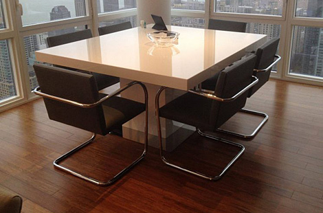 Modern styled office featuring custom upholstered conference chairs with metal frame overlooking the Manhattan skyline by Bespoke by Luigi Gentile.