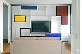 Bold and functional custom entertainment unit designed by Bespoke by Luigi Gentile, inspired by Piet Mondrian. Interiors by Studio Alain Vo.