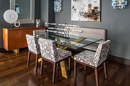 Custom upholstered armless dining chairs with tapered solid walnut legs by Bespoke by Luigi Gentile. Interiors: Rona Landman. Photography: Robert Granof.