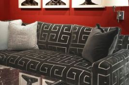 Custom Beekman upholstered loveseat amongst an eclectic living room. Interiors by John Michael Murphy. Upholstery: Bespoke by Luigi Gentile