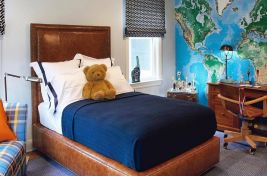 Custom brown leather upholstered headboard for an adventurous yet contemporary styled child's bedroom. Upholstery: Bespoke by Luigi Gentile Room designed by Robyn Karp Design.