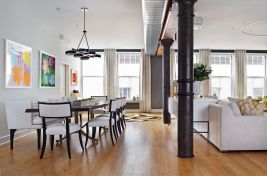 Wide shot view of a Bespoke custom Live Edge wood table with a custom metal base and side view of our custom Beekman upholstered sectional in this fabulous New York City apartment. \r\nInteriors: Rona Landman Interior Design\r\nUpholstery: Bespoke by Luigi Gentile