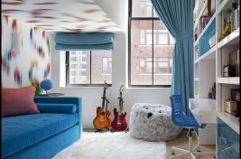 A fun and colorful girls room featuring a custom blue high riser with a hidden trundle bed below made by Bespoke by Luigi Gentile. \r\nDesigner: Rona Landman 
