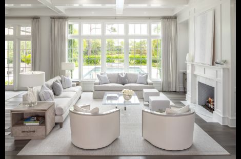 Elegant living room featuring our custom upholstered Felix chairs and Greenwich sofa in a luxurious Palm Beach home. \r\nInteriors: Robyn Karp Designs\r\nUpholstery: Bespoke by Luigi Gentile