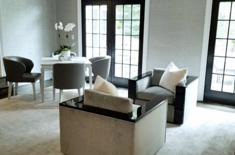 Elegant tonal sitting room, with a custom Parson chairs with high gloss blackened maple and custom upholstered curved back game chairs.  Designer: Ginger Surasky Upholstery: Bespoke by Luigi Gentile