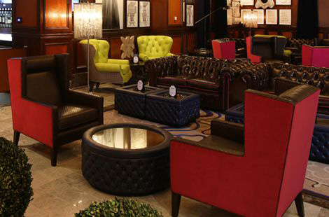 Eclectic inspired hospitality project for Harrah's Resort in Atlantic City. Featuring our tufted Watts Chesterfield sofas, upholstered ottoman tables and custom club chairs. 