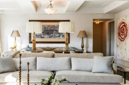 Luxurious custom upholstered Greenwich Sofa in light grey fabric with natural walnut wood rail. Designer: Penny Drue Baird/ Dessins LLC. Upholstery: Bespoke by Luigi Gentile.