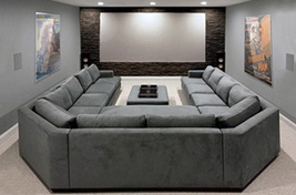 Custom upholstered Beekman sectional shown in a modular wrap around configuration, offering plentiful seating perfect for a theater room. Interiors: Studio Alain Vo