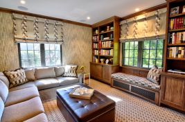 Fabulous family sitting room featuring our custom leonard storage ottoman. Designer: SGB Design. Upholstery: Bespoke by Luigi Gentile. Photography: Julie Brimber