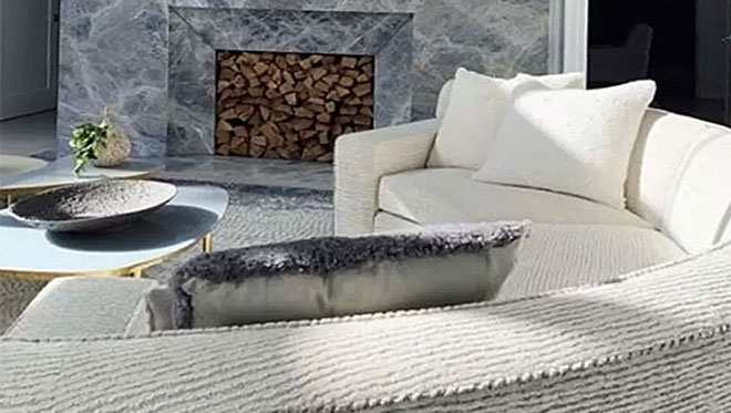 Close-up of back of curved sofa.