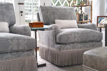 Enchanting Hamptons getaway, featuring our custom upholstered Bleeker Bridgewater club chair with a swivel base and traditional style.