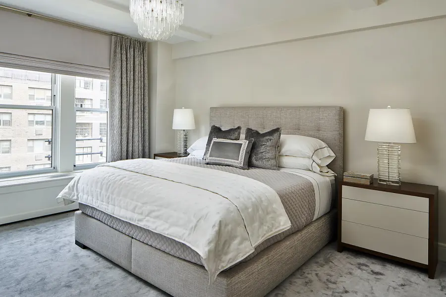 Custom upholstered Jefferson bed shown cool toned grey master bedroom on the Upper East Side.