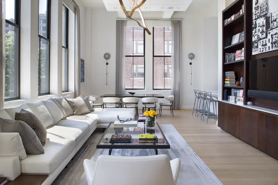 Elegant custom left arm facing L shaped sectional with wooden drink table and blackened steel metal coffee table with glass top.
