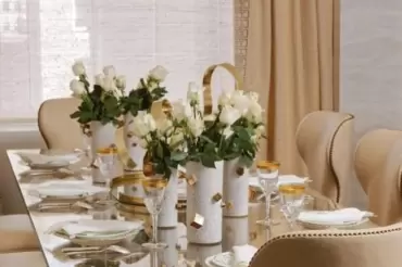 The Barkley dining chair showcases graceful winged curves, sof upholstery, nailhead trim, and plush comfort, exuding timelessness