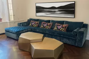 The beekman sectional is shown here with buttonless tufted seats and tailored, fitted back cushion. Features a recessed plinth base.