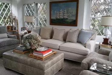 The Chelsea features tailored cushions, neutral textured upholstery, and plush comfort, blending timeless elegance with versatility.