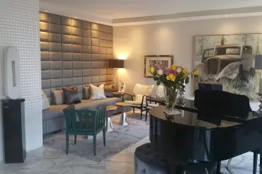 Wall-to wall, floor-to-ceiling masterpiece in upholstery! The bases open to drawers. A feat of creativity and know-how.