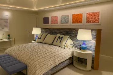 Wood trim, soft channeled upholstery, built in reading lights make this free standing bed a natural choice for the comfort minded individual