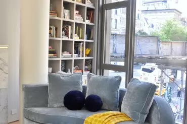 This fantastic bespoke back-to-back sofa built around the existing column, provide amazing seating from 2 sides. Creativity at its finest. 