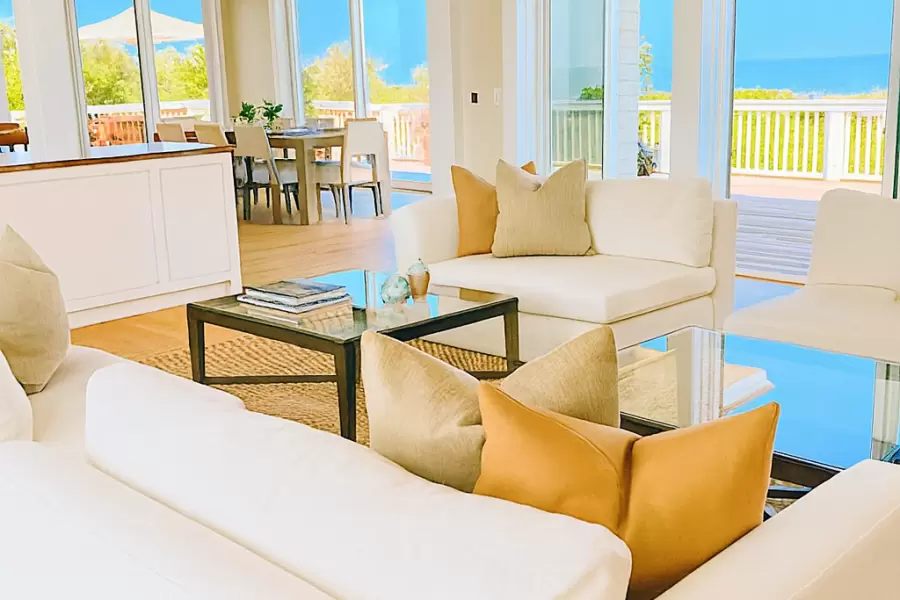 Four one arm chairs can be united into a 2 large sofas in this great waterfornt Livingroom by Sherry Brous