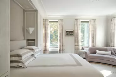 A serene and sensational primary bedroom adorned with Bespoke pieces.