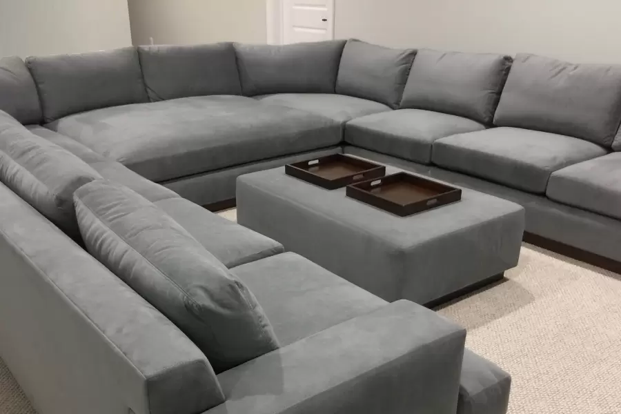 Our bespoke Beekman sectional and ottoman as a testament of comfort and style in this home media room-theatre. Extra deep for unparallelled lounging.
