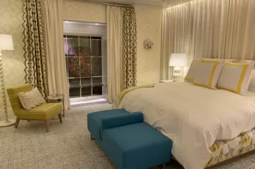 Our custom bed and Emerson chair shine in bright light in this suptuous bedroom by Scott Salvator