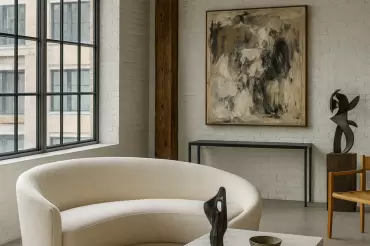 The Ilene is a sculptural, curved piece upholstered in a soft, boucle fabric. Its fluid silhouette creates a sense of modern elegance,